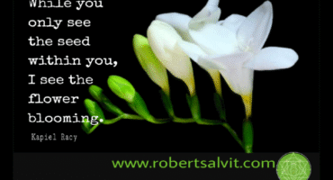 A white flower with the words 