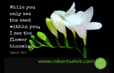 White flowers blossoming. “While you only see the seed within you…”