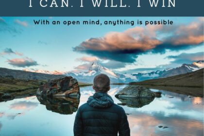 Person standing by tranquil lake at sunset.