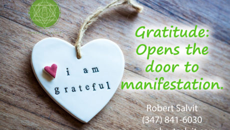 A heart pendant. “Gratitude: Opens the door to manifestation.”