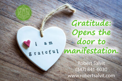 A heart hanging on the wall with words 